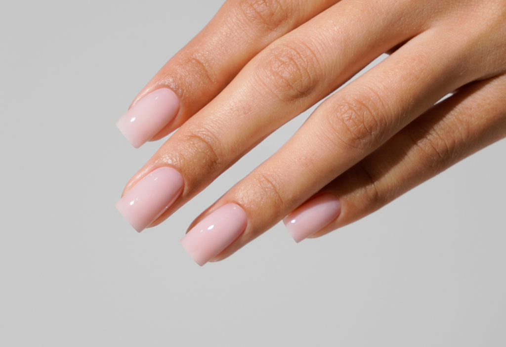 Close up of soap nails manicure with soft neutral sheer color