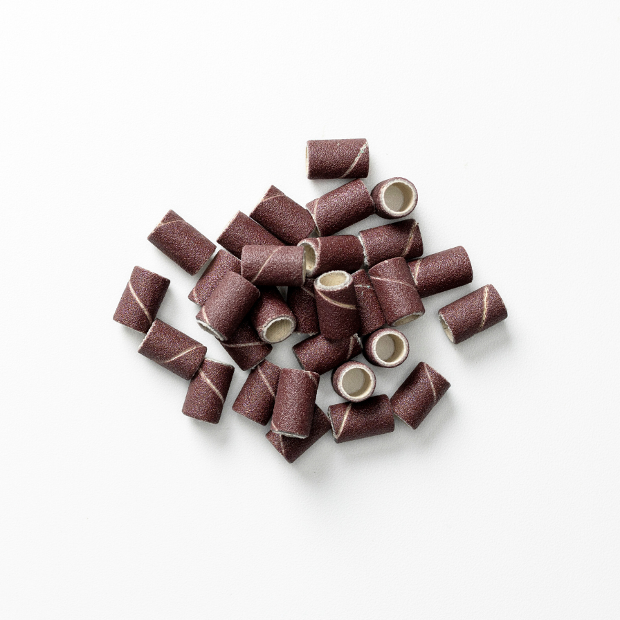 A pile of fine sanding bands for nails