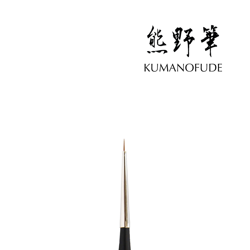 A close-up image of a Kokoist Thin Liner Brush with a pointed tip, used for creating fine lines in calligraphy or painting.