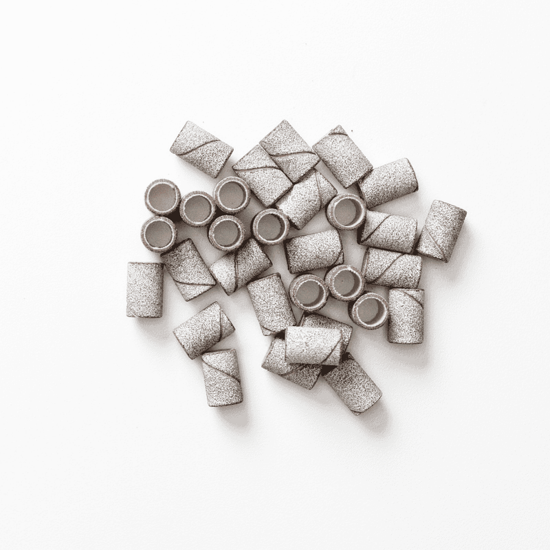 Pile of zebra sanding bands used for nail prep